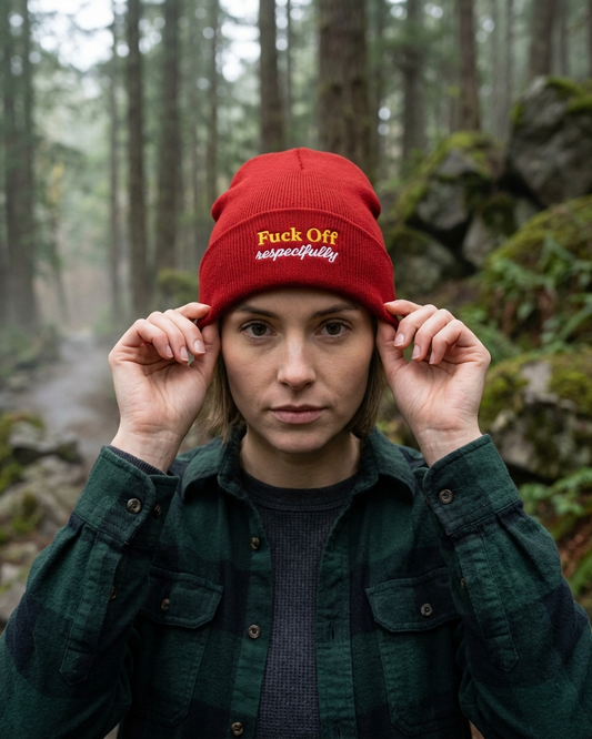 Person wearing a red beanie with text in a forest setting