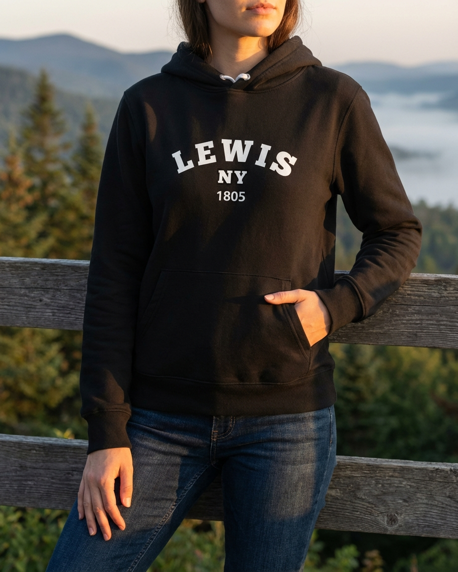 Person wearing a black hoodie with 'LEWIS NY 1805' text, standing outdoors with a scenic background.