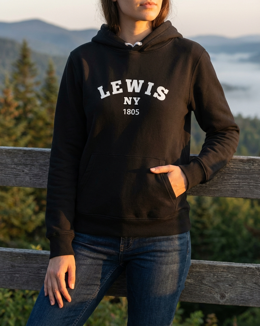 Person wearing a black hoodie with 'LEWIS NY 1805' text, standing outdoors with a scenic background.