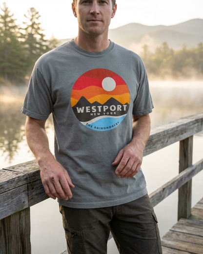 Man wearing a t-shirt with Westport, New York design by a lake